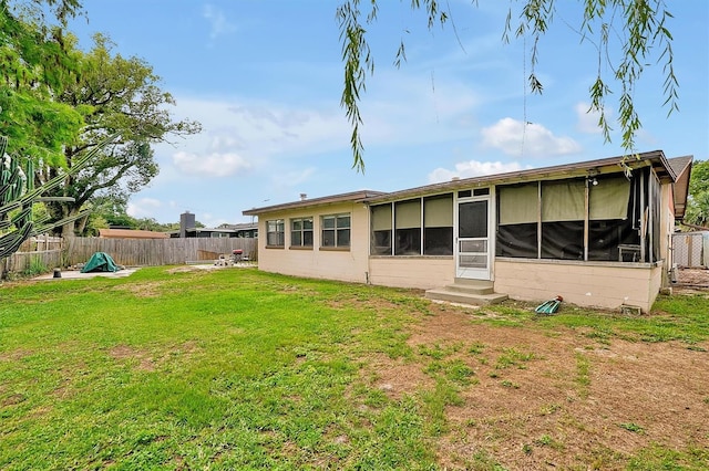 2007 Mosher Dr, Orlando, FL 32810 - back of property with a sunroom and entry steps