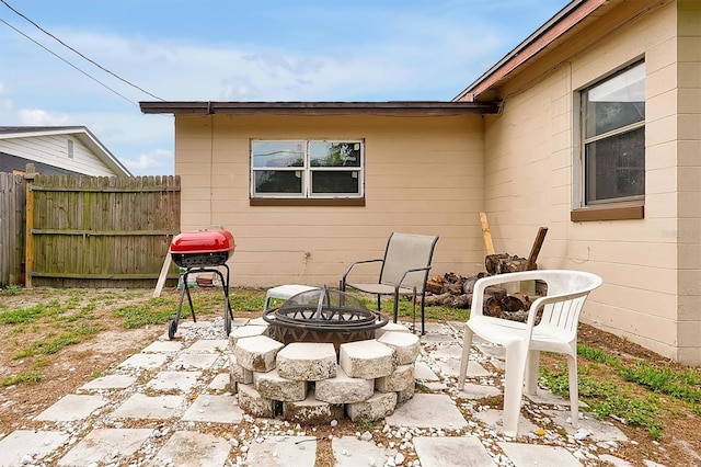 2007 Mosher Dr, Orlando, FL 32810 - view of patio featuring an outdoor fire pit and area for grilling