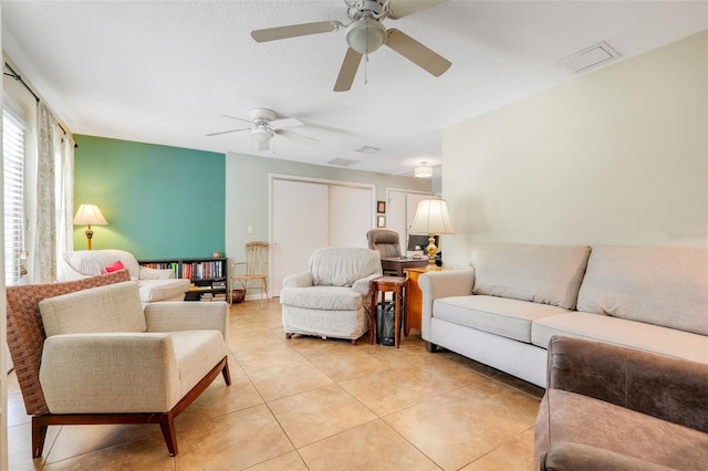 410 E Gulley Ave, Oakland, FL 34760 - living room featuring a ceiling fan and light tile patterned floors