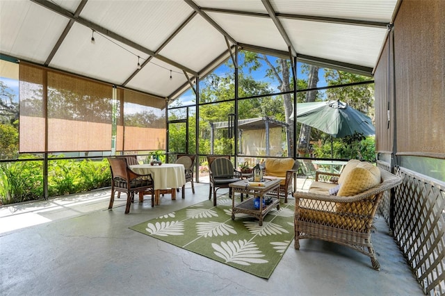 410 E Gulley Ave, Oakland, FL 34760 - sunroom with vaulted ceiling and outdoor lounge area