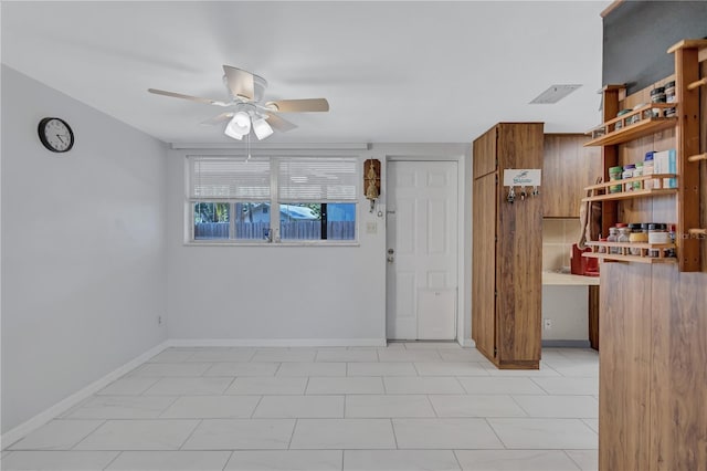 6443 34th Ave N, Saint Petersburg, FL 33710 - empty room with a ceiling fan and baseboards