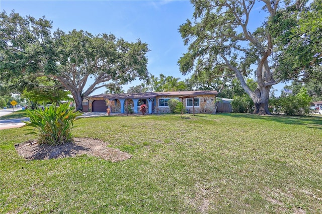 6443 34th Ave N, Saint Petersburg, FL 33710 - single story home featuring a front yard and an attached garage