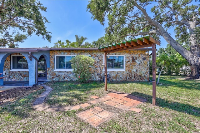 6443 34th Ave N, Saint Petersburg, FL 33710 - view of front of property with stone siding and a front yard