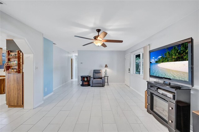 6443 34th Ave N, Saint Petersburg, FL 33710 - living room featuring ceiling fan and baseboards