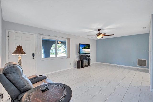 6443 34th Ave N, Saint Petersburg, FL 33710 - living room with ceiling fan and baseboards