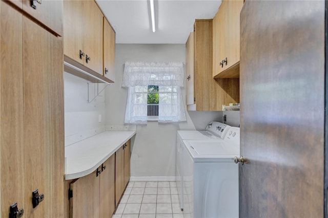 6443 34th Ave N, Saint Petersburg, FL 33710 - laundry area featuring cabinet space, washer and clothes dryer, light tile patterned floors, and baseboards