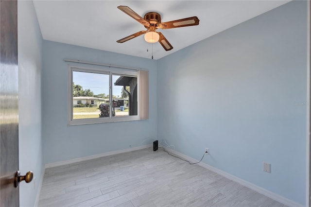 6443 34th Ave N, Saint Petersburg, FL 33710 - empty room with ceiling fan, light wood-type flooring, and baseboards