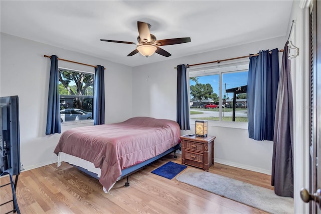6443 34th Ave N, Saint Petersburg, FL 33710 - bedroom featuring wood finished floors, a ceiling fan, and baseboards