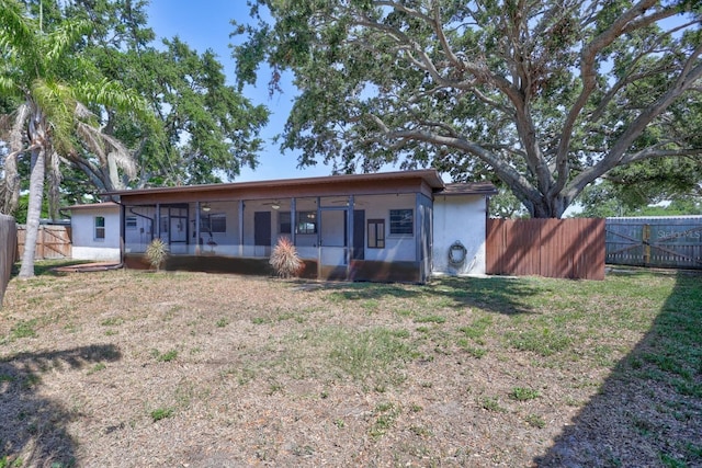 6443 34th Ave N, Saint Petersburg, FL 33710 - view of front of home featuring a sunroom and a gate