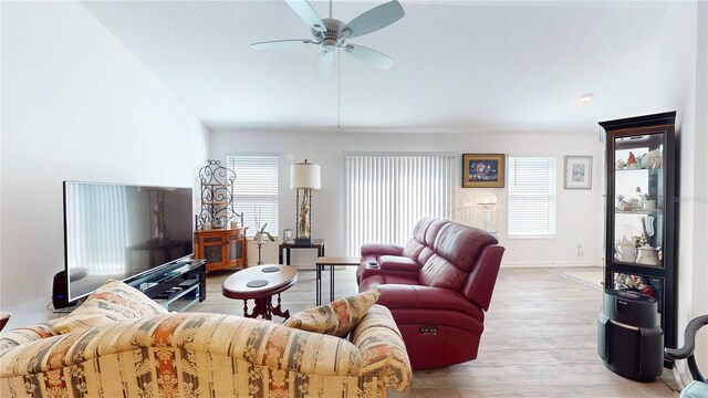 3817 Miragalia Ln, The Villages, FL 32163 - living area with ceiling fan, wood finished floors, and baseboards