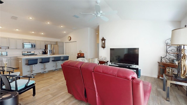 3817 Miragalia Ln, The Villages, FL 32163 - living area featuring vaulted ceiling, ceiling fan, light wood-style floors, and recessed lighting