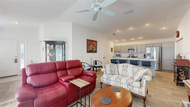 3817 Miragalia Ln, The Villages, FL 32163 - living area with vaulted ceiling, light wood-style flooring, a ceiling fan, and recessed lighting