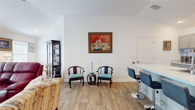 3817 Miragalia Ln, The Villages, FL 32163 - living area with light wood-style flooring, lofted ceiling, baseboards, and recessed lighting