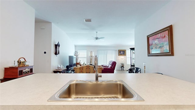 3817 Miragalia Ln, The Villages, FL 32163 - kitchen with a sink, light countertops, a ceiling fan, and open floor plan