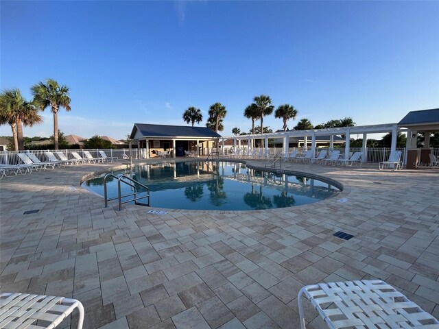 3817 Miragalia Ln, The Villages, FL 32163 - community pool featuring a patio area