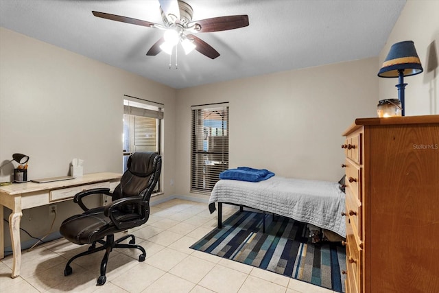 22 Palm Circle Dr, Inglis, FL 34449 - bedroom with light tile patterned floors, an office area, and a ceiling fan