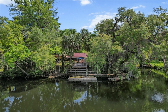 22 Palm Circle Dr, Inglis, FL 34449 - dock featuring a deck with water view