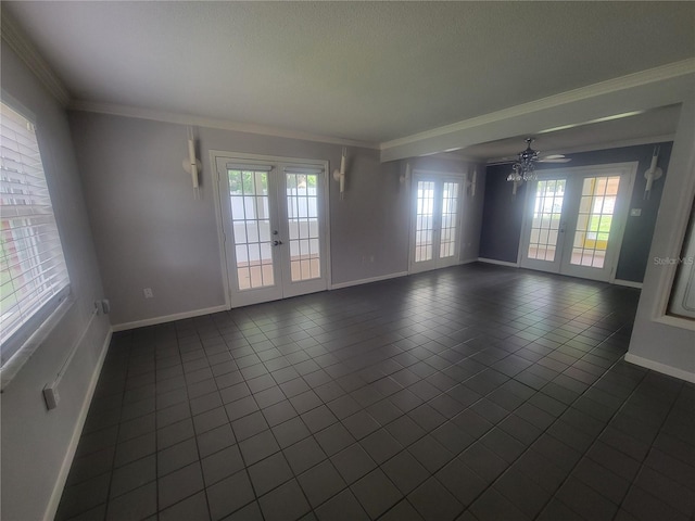 6924 Nawadaha Blvd, Orlando, FL 32818 - empty room featuring french doors, dark tile patterned flooring, and ornamental molding