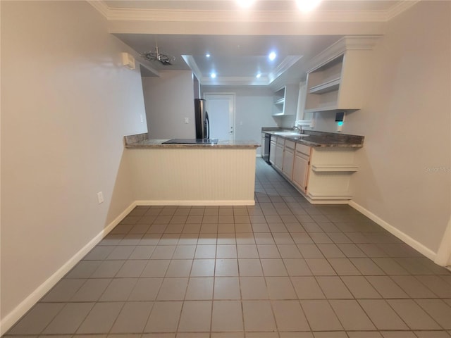 6924 Nawadaha Blvd, Orlando, FL 32818 - kitchen featuring open shelves, a peninsula, freestanding refrigerator, crown molding, and tile patterned floors