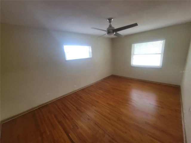 6924 Nawadaha Blvd, Orlando, FL 32818 - empty room with wood finished floors and a ceiling fan