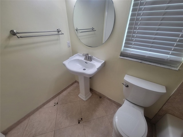 6924 Nawadaha Blvd, Orlando, FL 32818 - bathroom with tile patterned floors and baseboards
