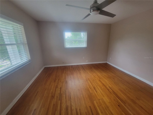 6924 Nawadaha Blvd, Orlando, FL 32818 - unfurnished room with wood finished floors and a ceiling fan