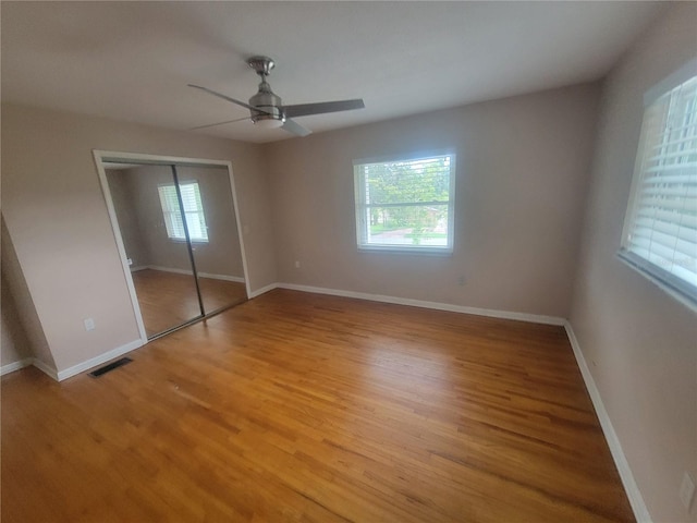 6924 Nawadaha Blvd, Orlando, FL 32818 - unfurnished bedroom featuring light wood finished floors, a closet, and ceiling fan
