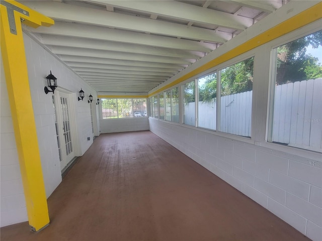 6924 Nawadaha Blvd, Orlando, FL 32818 - unfurnished sunroom with healthy amount of natural light, french doors, wood finished floors, and concrete block wall