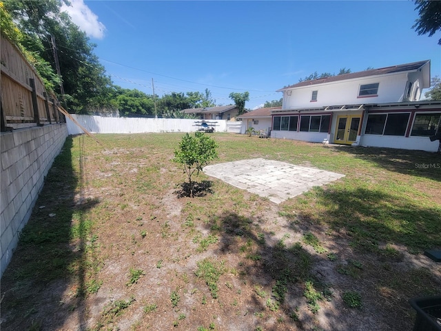 6924 Nawadaha Blvd, Orlando, FL 32818 - fenced yard with a sunroom, french doors, and a patio