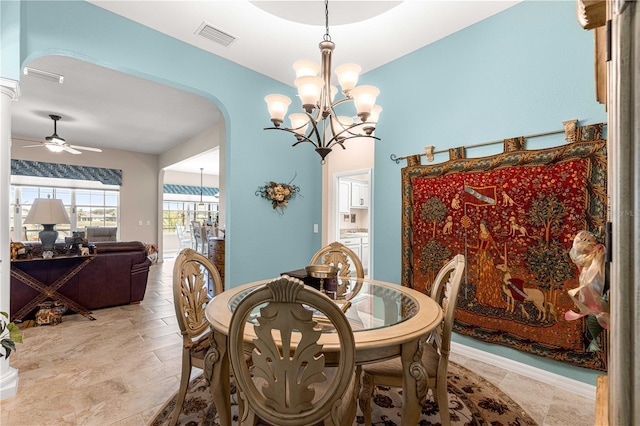 11215 SE 172nd Pl, Summerfield, FL 34491 - dining room featuring arched walkways, a chandelier, and ceiling fan