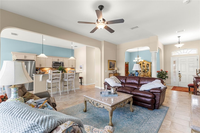 11215 SE 172nd Pl, Summerfield, FL 34491 - living room featuring arched walkways, ceiling fan, and a chandelier