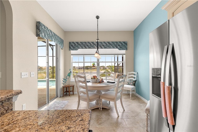 11215 SE 172nd Pl, Summerfield, FL 34491 - dining room with baseboards and light tile patterned floors