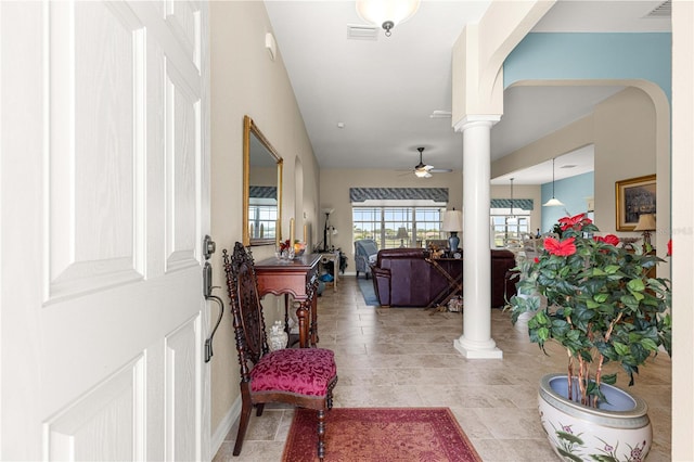 11215 SE 172nd Pl, Summerfield, FL 34491 - entryway featuring ornate columns, ceiling fan, and arched walkways