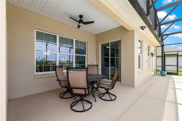 11215 SE 172nd Pl, Summerfield, FL 34491 - view of patio featuring a ceiling fan, glass enclosure, and outdoor dining area
