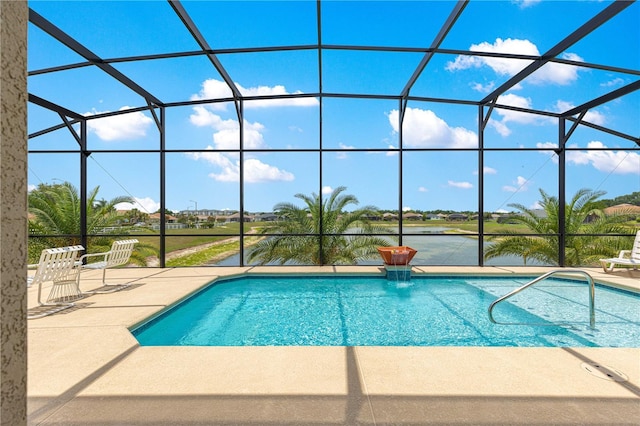 11215 SE 172nd Pl, Summerfield, FL 34491 - outdoor pool featuring a patio area, glass enclosure, and a water view