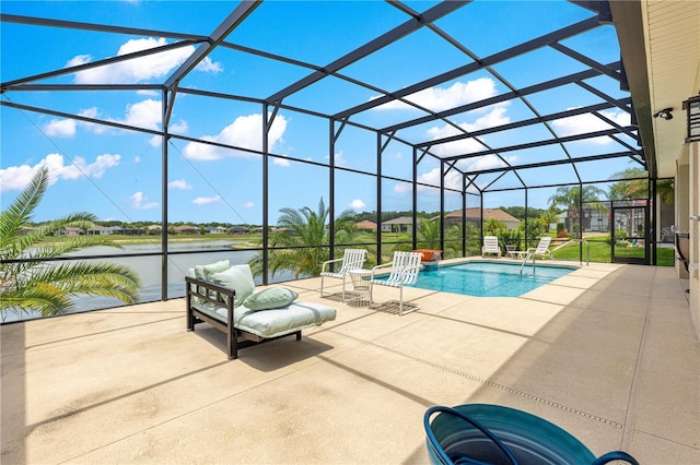 11215 SE 172nd Pl, Summerfield, FL 34491 - swimming pool featuring a patio, a water view, and glass enclosure