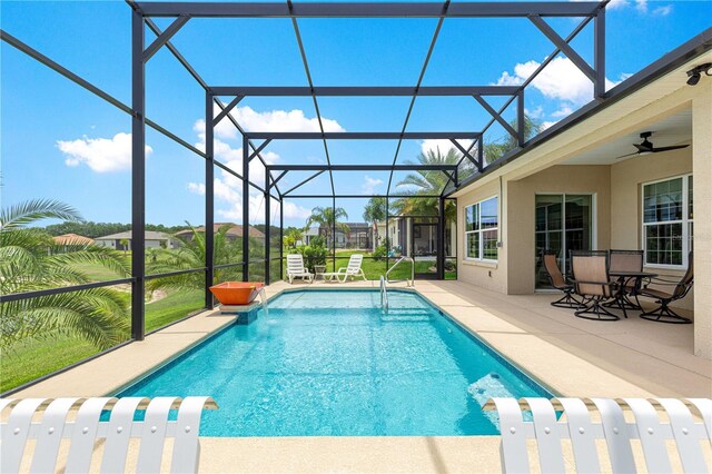 11215 SE 172nd Pl, Summerfield, FL 34491 - outdoor pool featuring a patio, glass enclosure, and ceiling fan