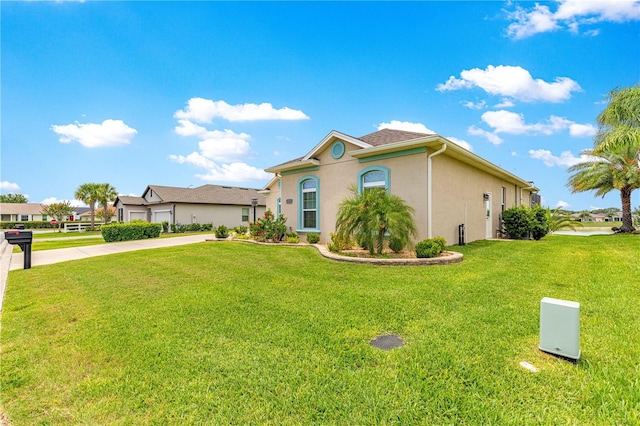 11215 SE 172nd Pl, Summerfield, FL 34491 - mediterranean / spanish house with a front lawn and stucco siding