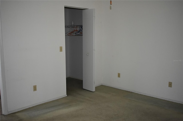 610 Swallow Ct, Apopka, FL 32712 - unfurnished bedroom with light carpet, a walk in closet, and a closet