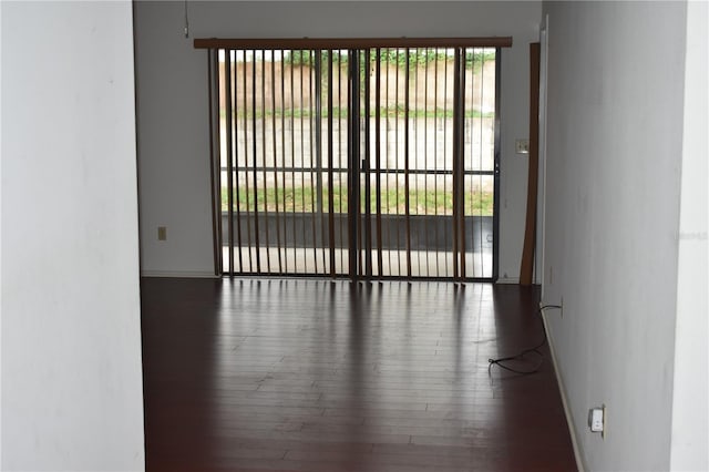 610 Swallow Ct, Apopka, FL 32712 - empty room with wood finished floors and baseboards