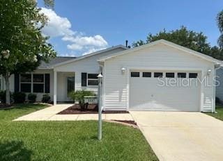 3337 Candlebrook St, The Villages, FL 32162 - ranch-style home with an attached garage, concrete driveway, and a front yard
