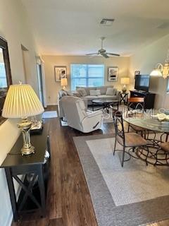 3337 Candlebrook St, The Villages, FL 32162 - living area featuring wood finished floors and a ceiling fan