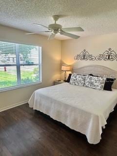 3337 Candlebrook St, The Villages, FL 32162 - bedroom with a textured ceiling, baseboards, dark wood-type flooring, and a ceiling fan