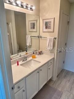 3337 Candlebrook St, The Villages, FL 32162 - bathroom featuring vanity, toilet, and wood finished floors