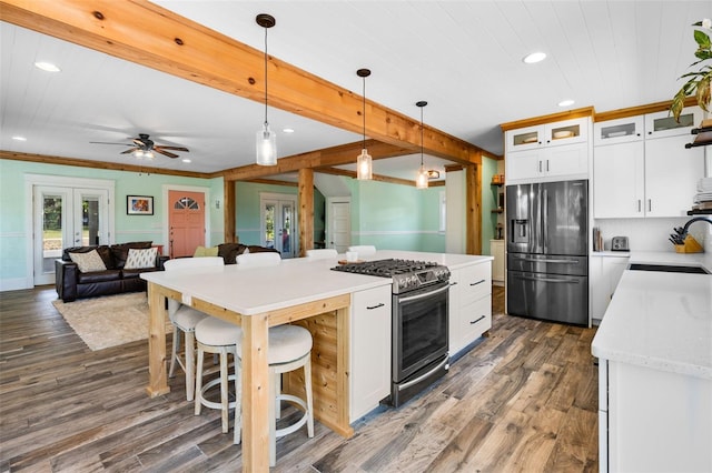 378 W Osceola St, Clermont, FL 34711 - kitchen with appliances with stainless steel finishes, a sink, recessed lighting, dark wood-style floors, and white cabinetry