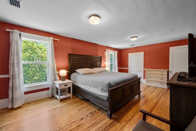 378 W Osceola St, Clermont, FL 34711 - bedroom featuring light wood-style floors and baseboards