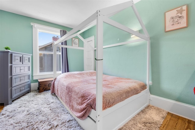 378 W Osceola St, Clermont, FL 34711 - bedroom with wood finished floors and baseboards
