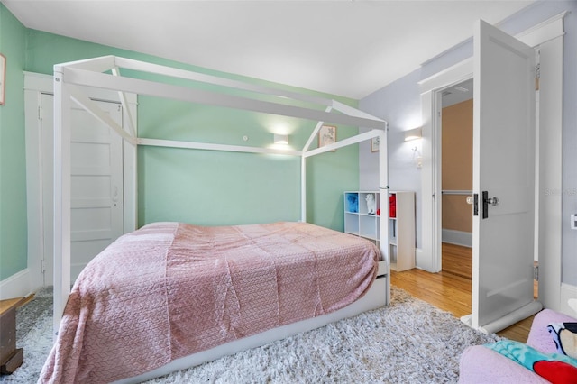 378 W Osceola St, Clermont, FL 34711 - bedroom featuring wood finished floors and baseboards
