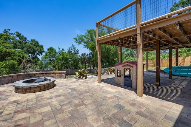 378 W Osceola St, Clermont, FL 34711 - fenced backyard with an outdoor fire pit and a patio area