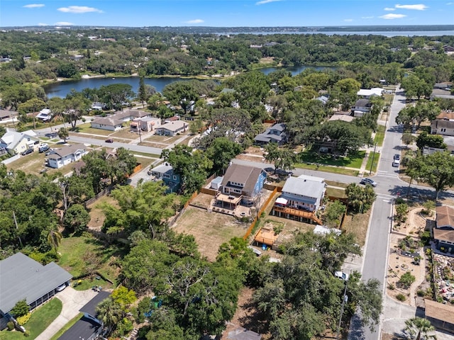 378 W Osceola St, Clermont, FL 34711 - aerial view of property's location with a nearby body of water, nearby suburban area, and a tree filled landscape